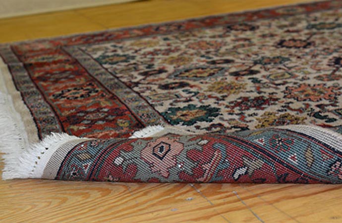 indian rug on wooden floor