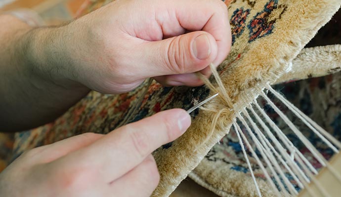 Reweaving and repairing rugs